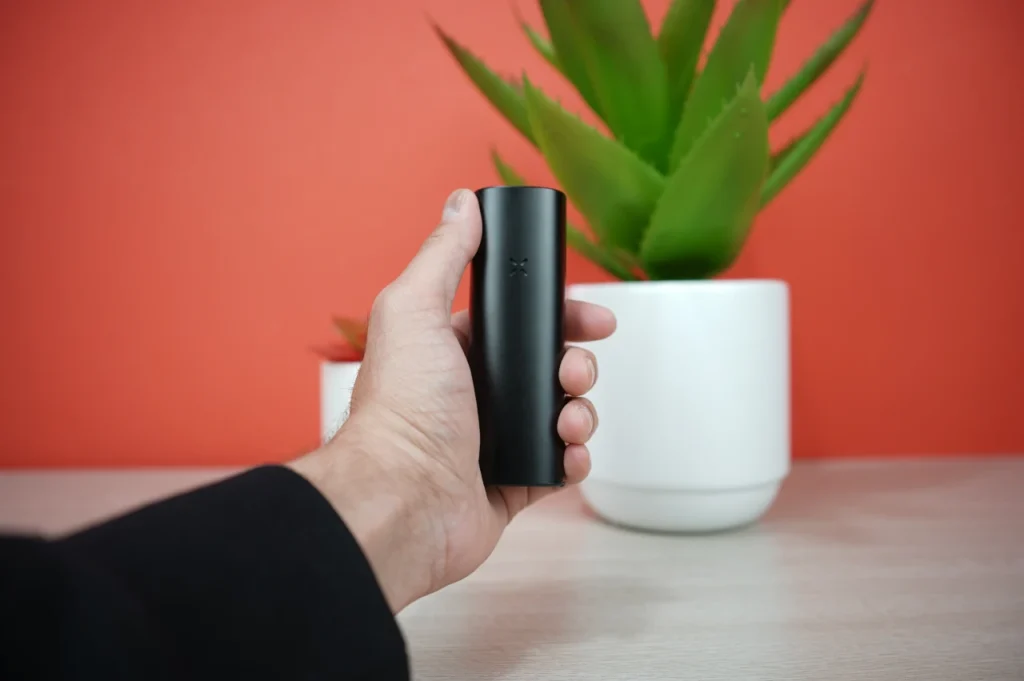 Handheld size comparison of the compact Pax 4 portable vape
