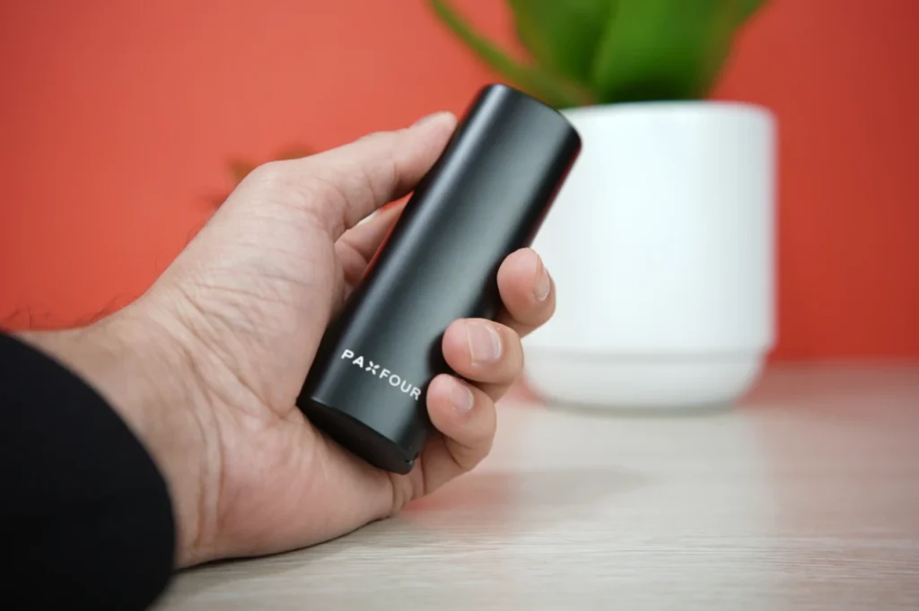 Pax 4 dry herb vaporizer branding logo close up in hand