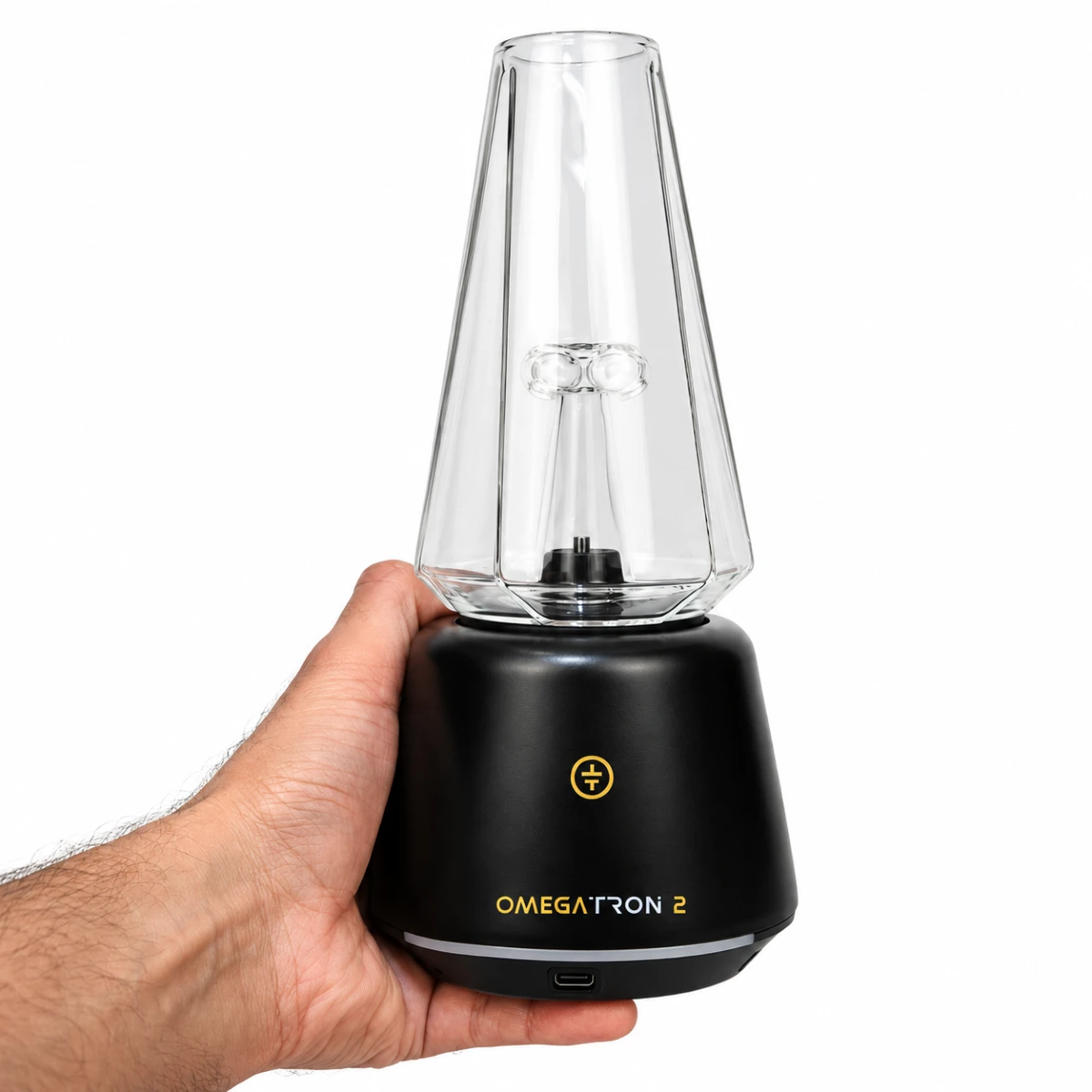 Hand holding Tronian Omegatron 2 black concentrate vaporizer with clear glass cup attachment