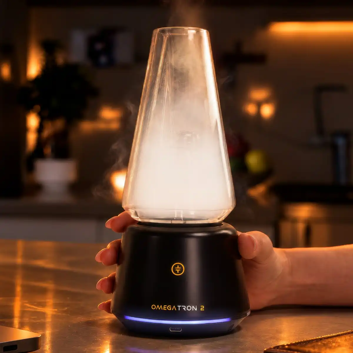 Tronian Omegatron 2 Vapor Cup in black with LED base ring filling glass cup with dense vapor